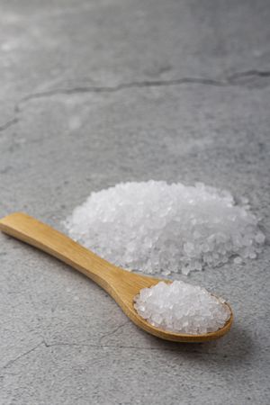 Handful of coarse salt on the table.