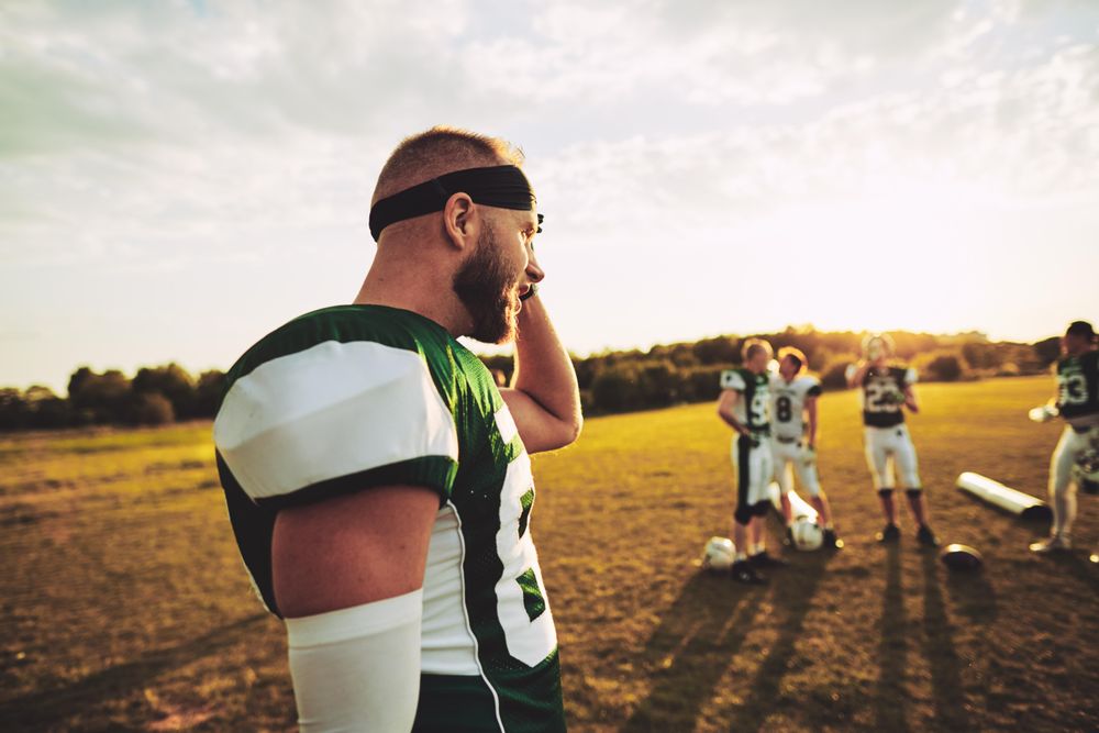 Football player with helmet off after a game
