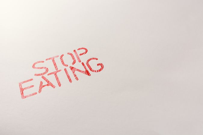 Simple red inscription calling to stop eating
