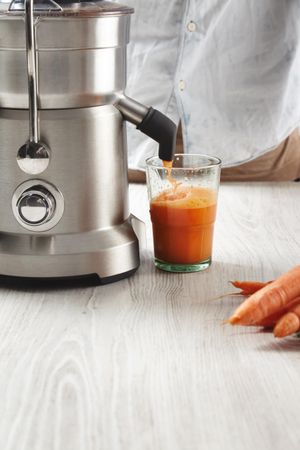 Close up of carrot being juiced