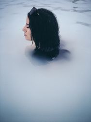 Woman submerged in hot spring