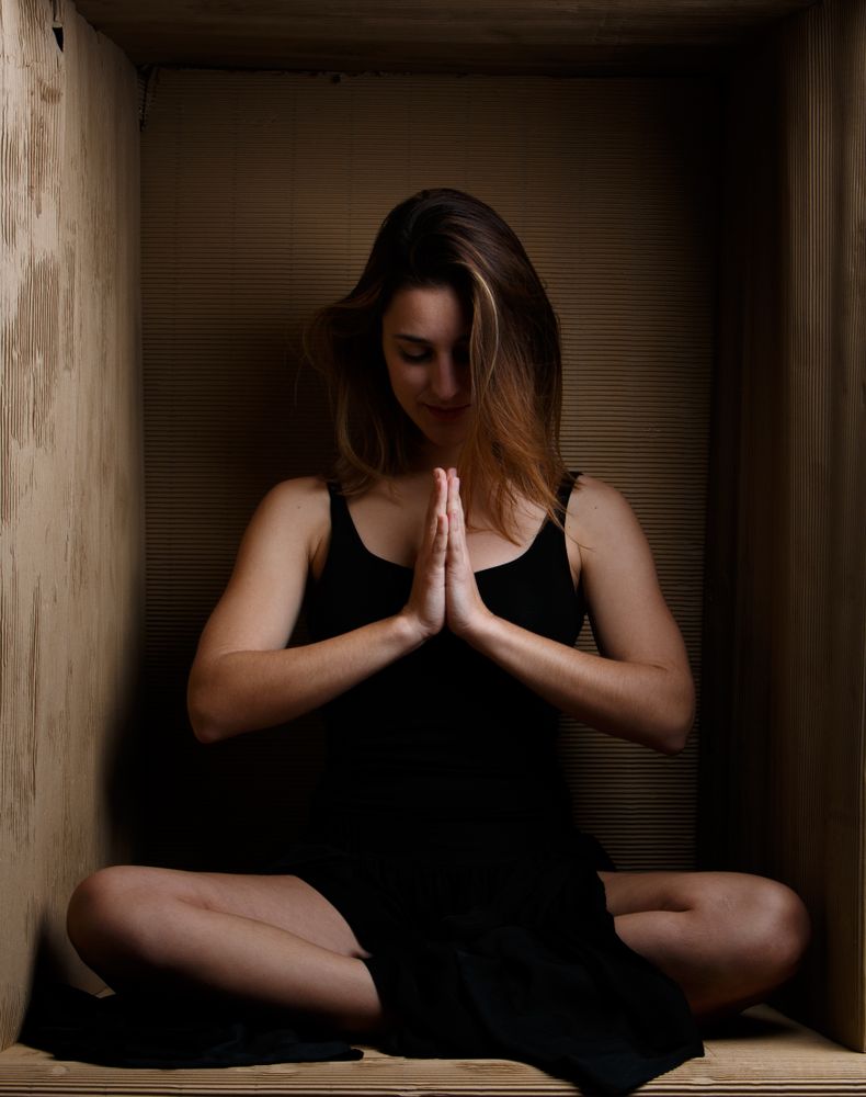 woman sitting in carton box