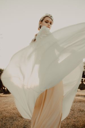 Woman in dress posing on nature