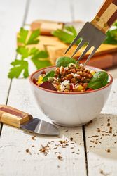 Bright vegetables with lentils and spinach in bowl