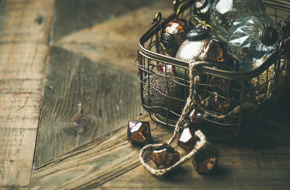 Christmas tree decorations in wire box, close up, copy space