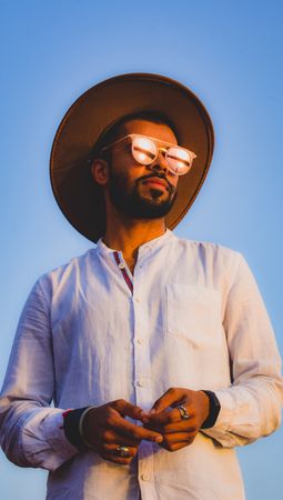 Portrait of man wearing sunglasses and hat outdoor