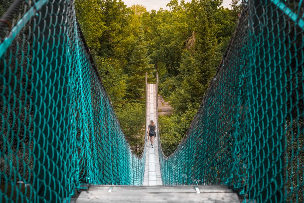 Woman walking on bridge in nature