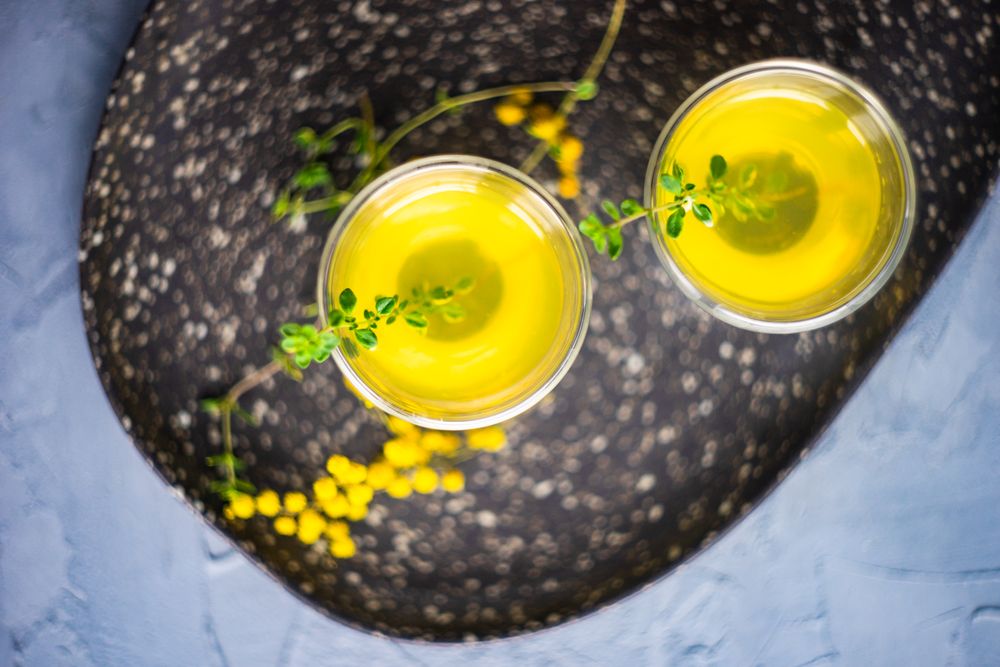 Top view of two glasses of limoncello with garnish