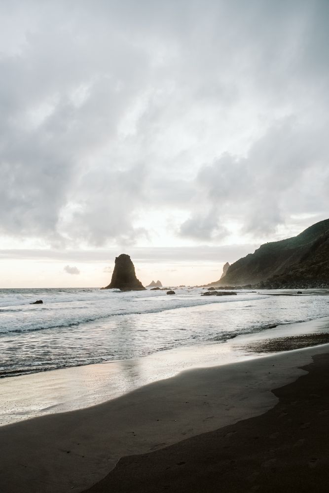 Lonely cliff in sea on cloudy day