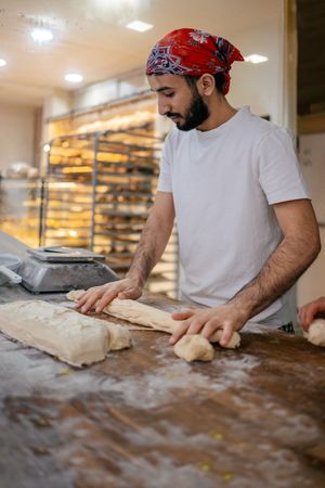 Arabic baker kneading in bakery