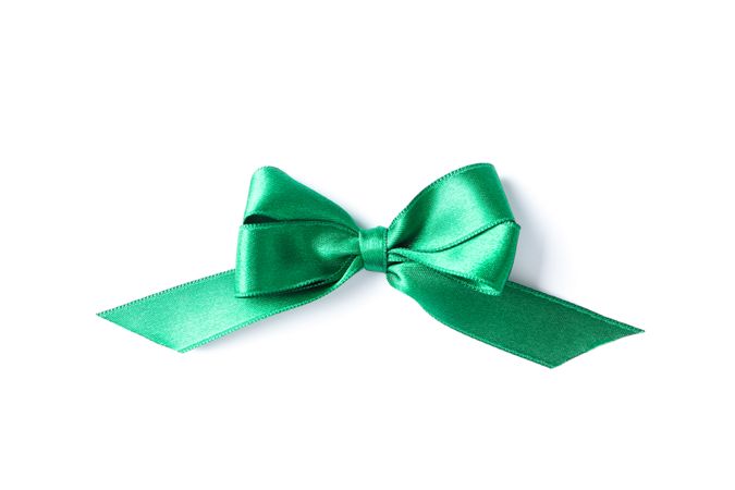 Green bow isolated on plain background. Gift concept