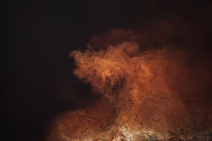 Smoke over water in brown light
