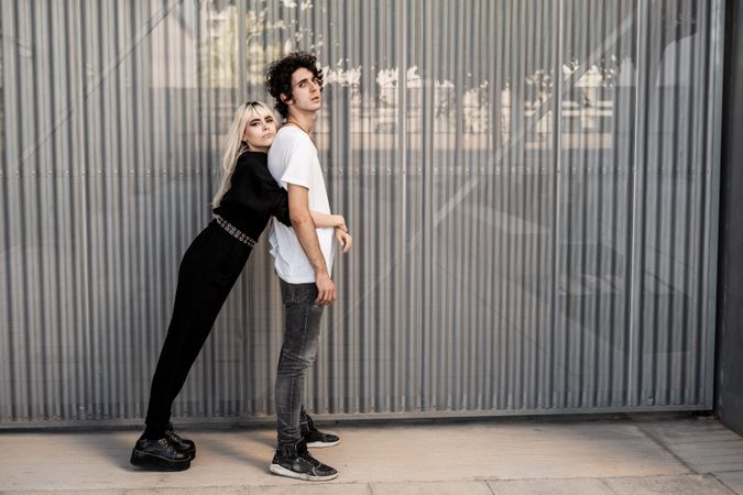 Couple near stripped modern building