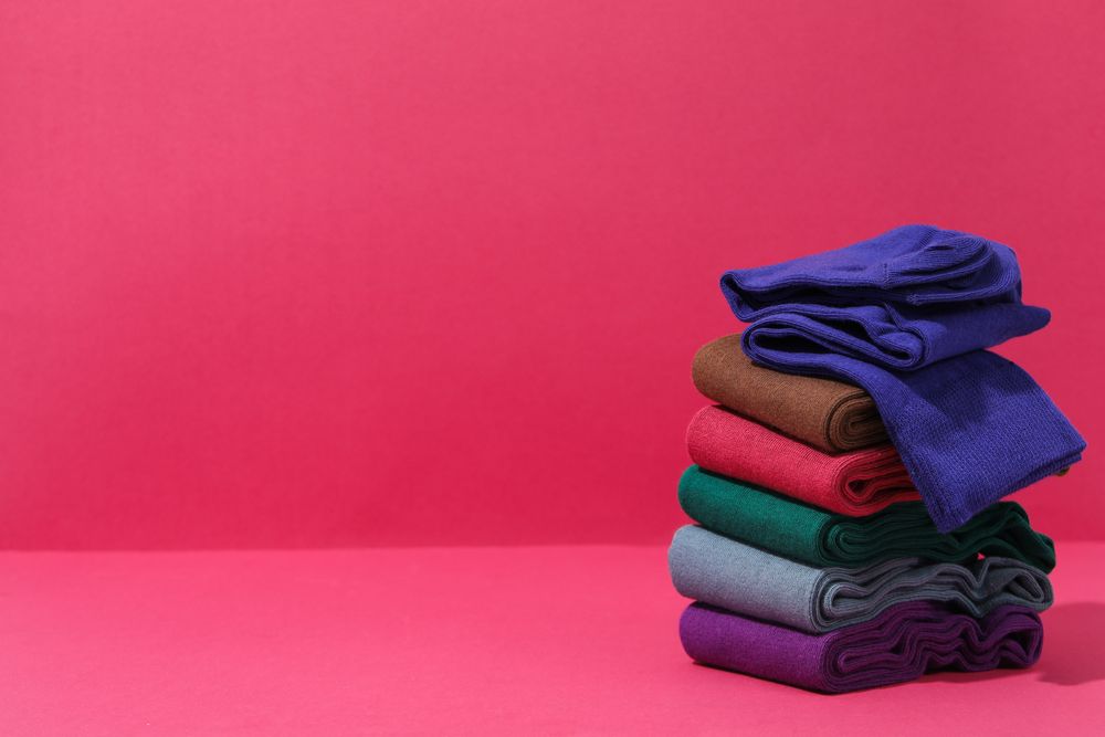 Concept of clothes for legs - socks, space for text