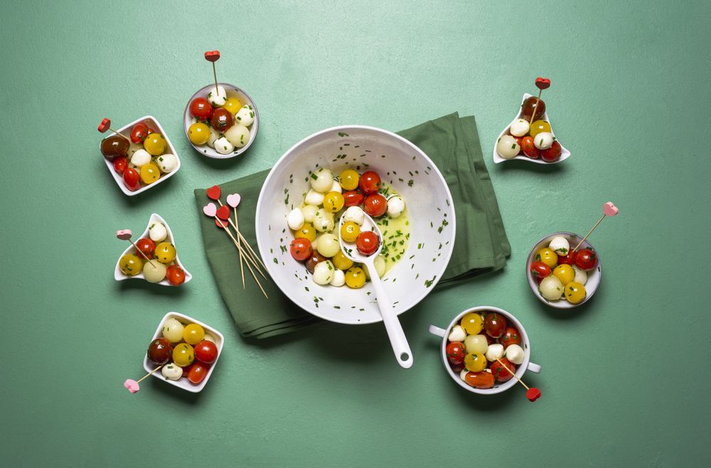Summer salad with tomatoes and mozzarella eaten