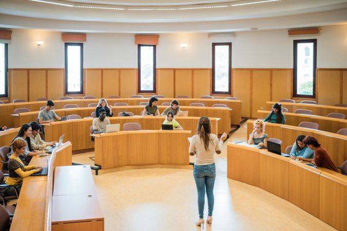 Teacher giving assignment to students