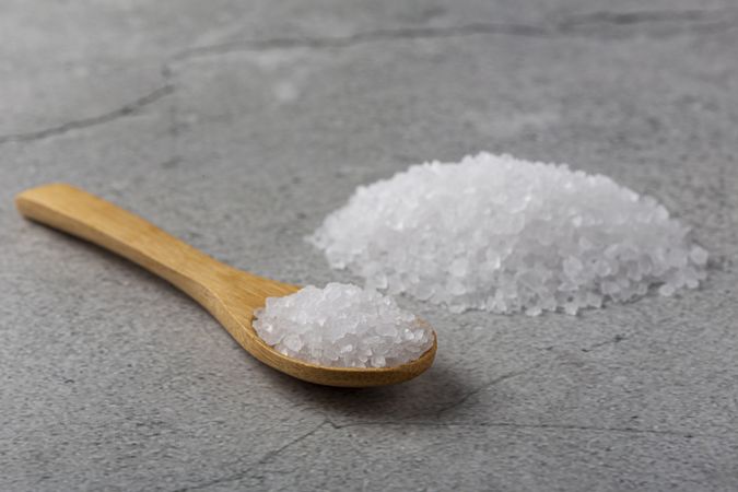 Handful of coarse salt on the table.