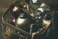 Christmas tree decorations in wire box, close up
