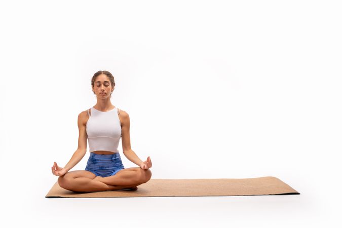 Serene yoga practice with copy space: lotus pose on eco-friendly mat
