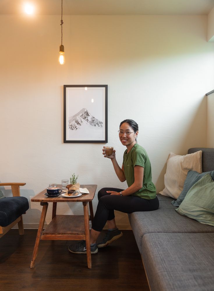 Woman eating lunch in her living room