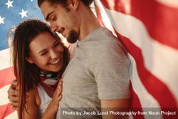 Couple in love with American flag around 41ww80
