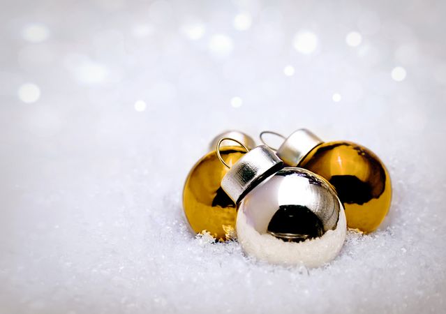 Christmas holiday baubles on snow