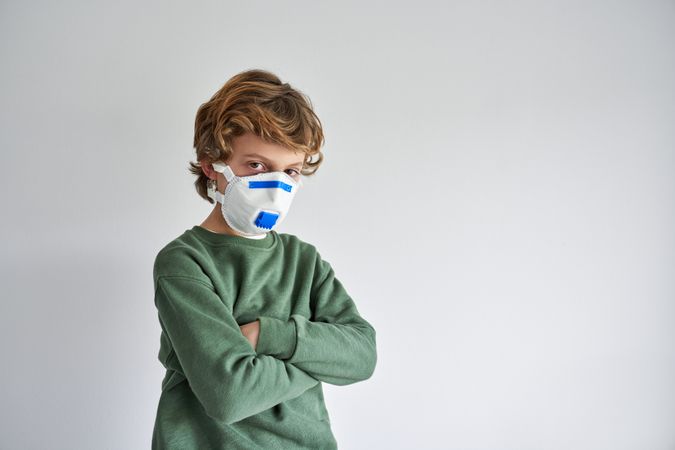 Child wearing protective face mask
