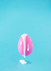 Pink Easter egg with creamy filling coming out