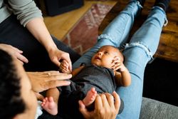 Cute new born baby in mother’s lap