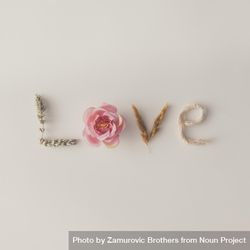 Word LOVE made out of flowers and dried branches 0VgkN5