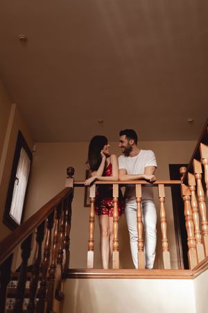 Couple looking at each other on stairway