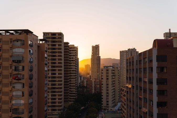 Residential buildings against sunset sky