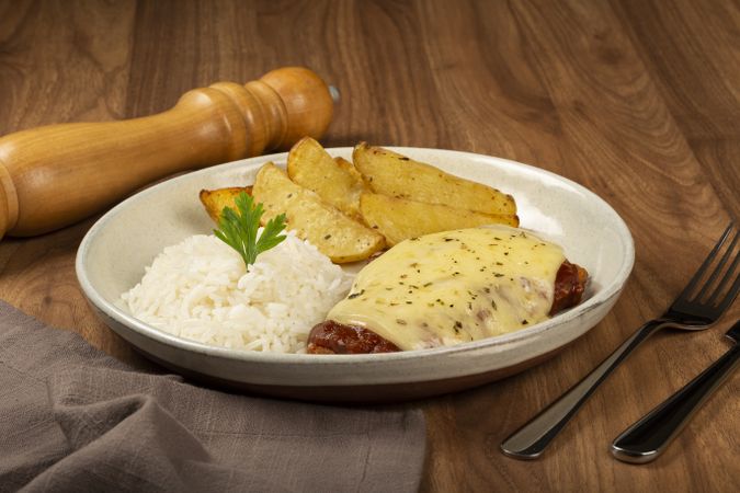 Parmigiana steak with rice and roasted potatoes. Typical Brazilian dish.