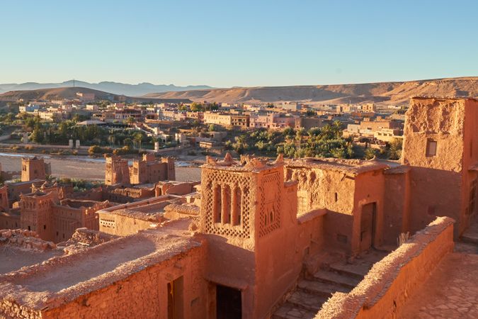 Ancient city near river in desert and wonderful sky