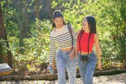 Chinese female friends walking outside