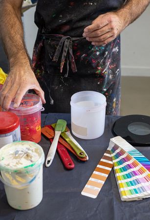Artist preparing paints for serigraphy
