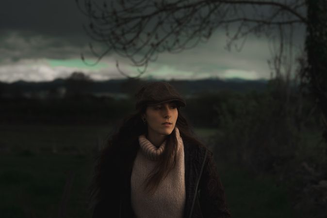 Young woman in warm clothes in forest