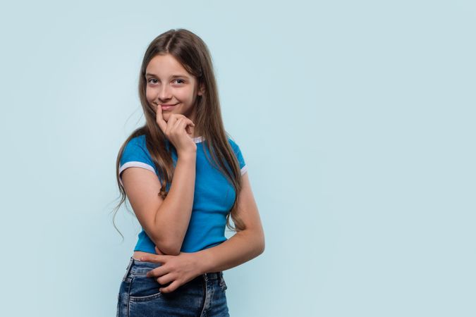 Girl thoughtfully considering something while looking away