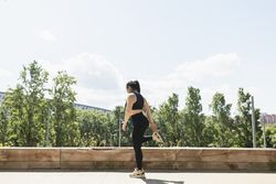 A woman relaxes her legs, during an exercise session, Zaragoza, Spain