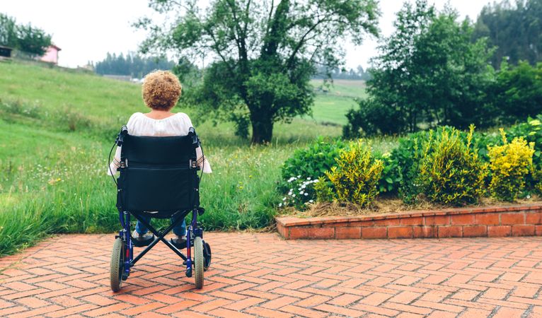 Unrecognizable mature woman in a wheelchair