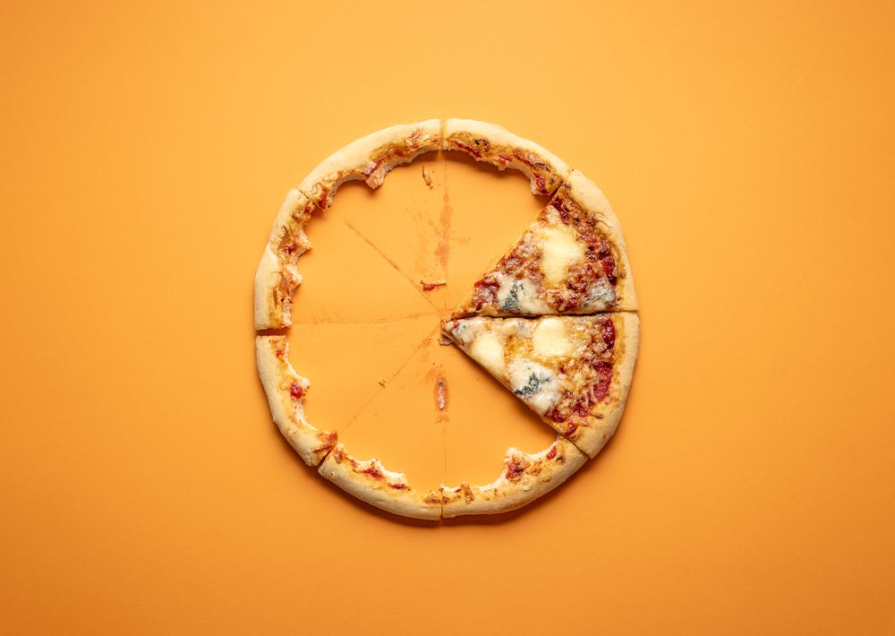 Four cheese pizza slices and crust leftovers