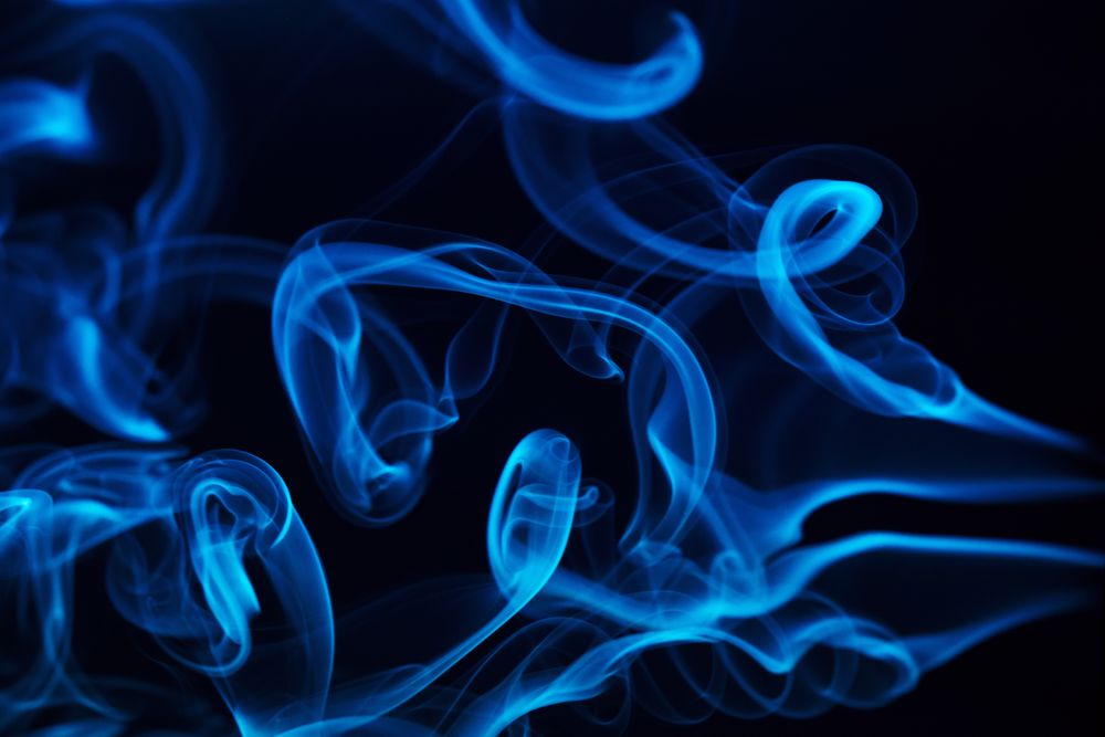 Colorful smoke on dark background