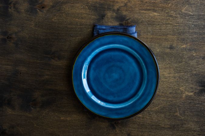 Blue plate on wooden table
