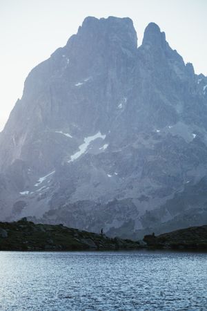 Majestic mountain landscape with human silhouette