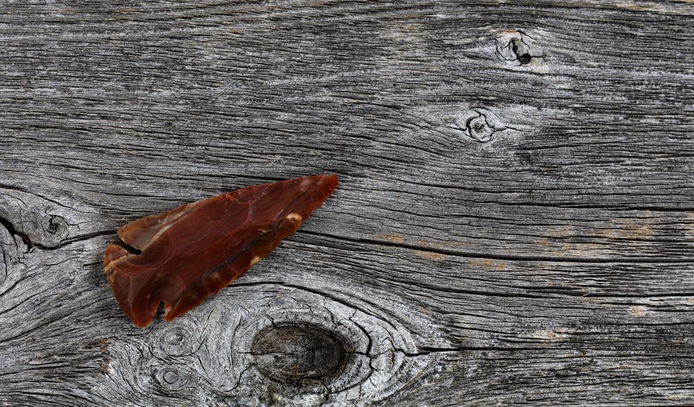 Large arrowhead on old wood