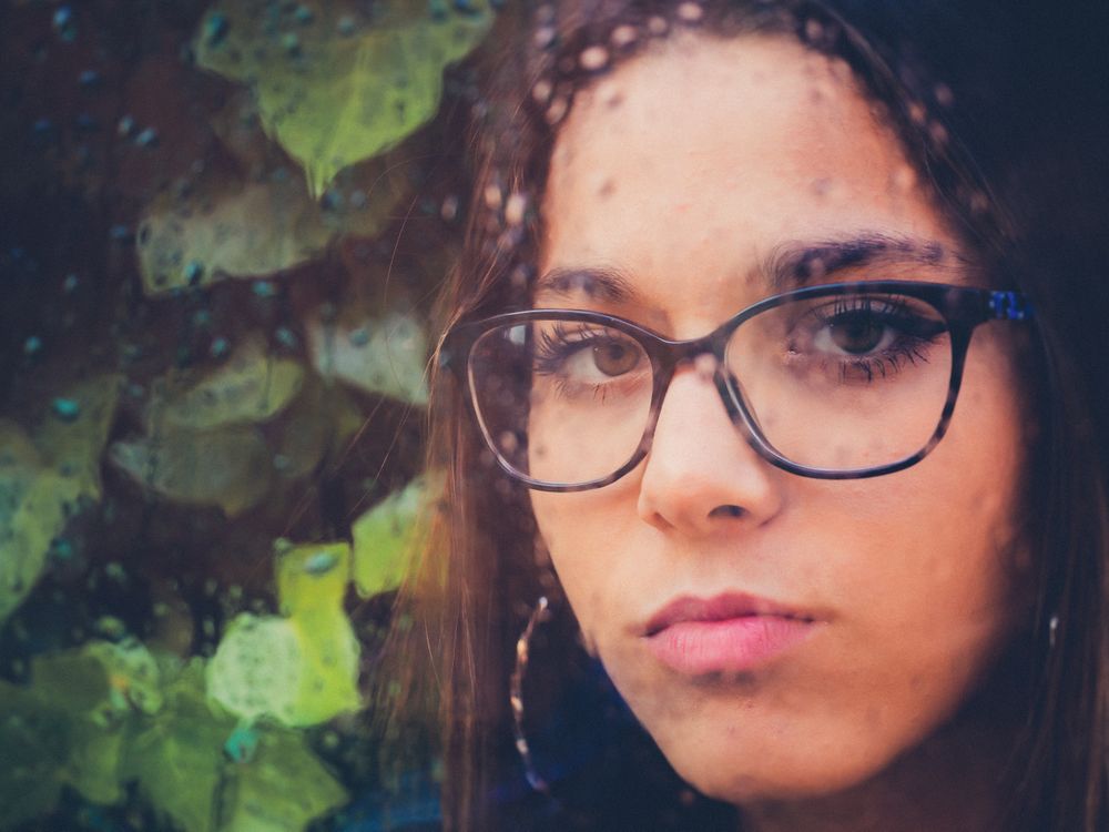 Woman in eyeglasses and earrings