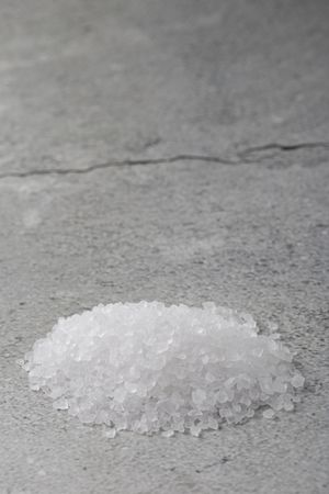 Handful of coarse salt on the table.
