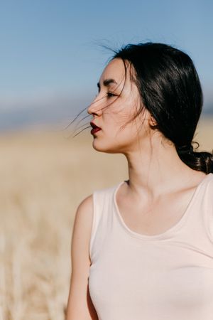 Model standing in field