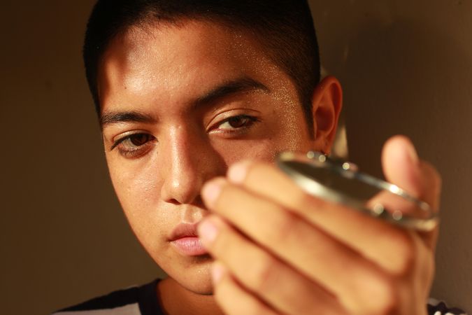 Portrait of teenage boy holding an object