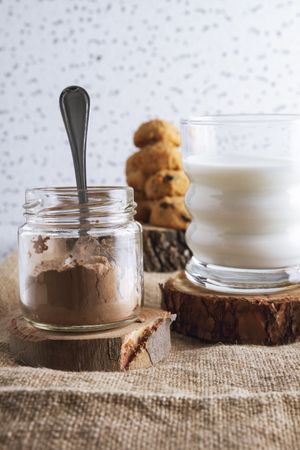 Cacao powered and milk for cooking homemade cookies with chocolate crumbs